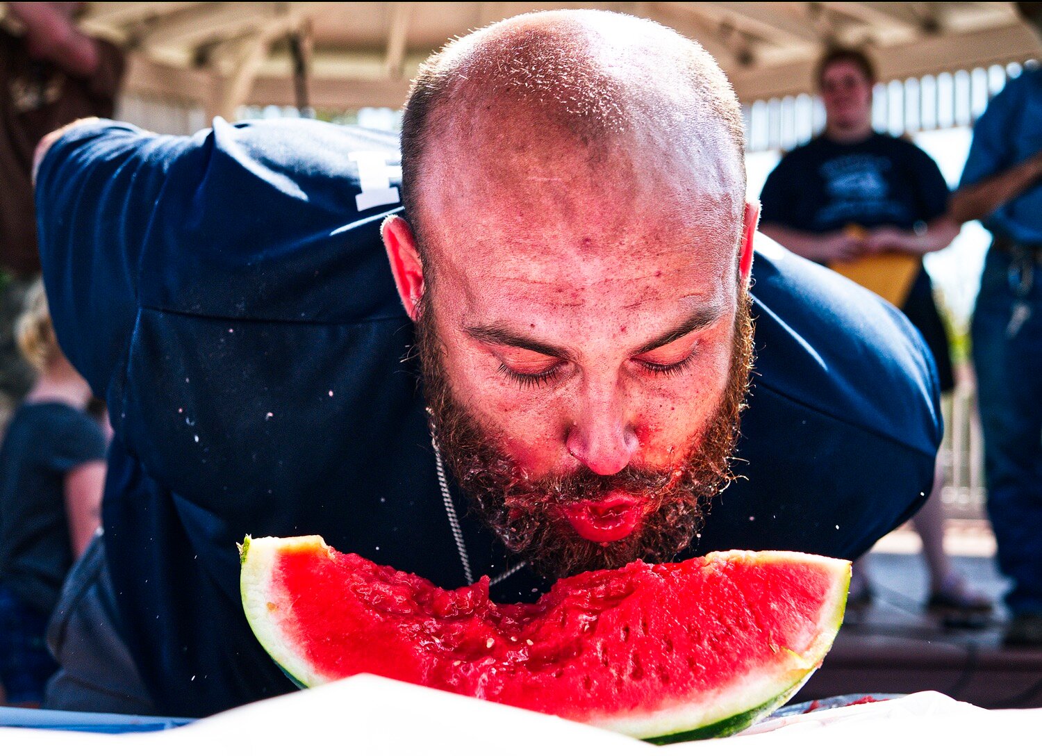 Justin Green of Point won the adult division of the watermelon-eating contest, defeating two-time-defending champ Josh Davis in a tie-breaking eat-off of a third slice of watermelon. [additional iron horse images available]